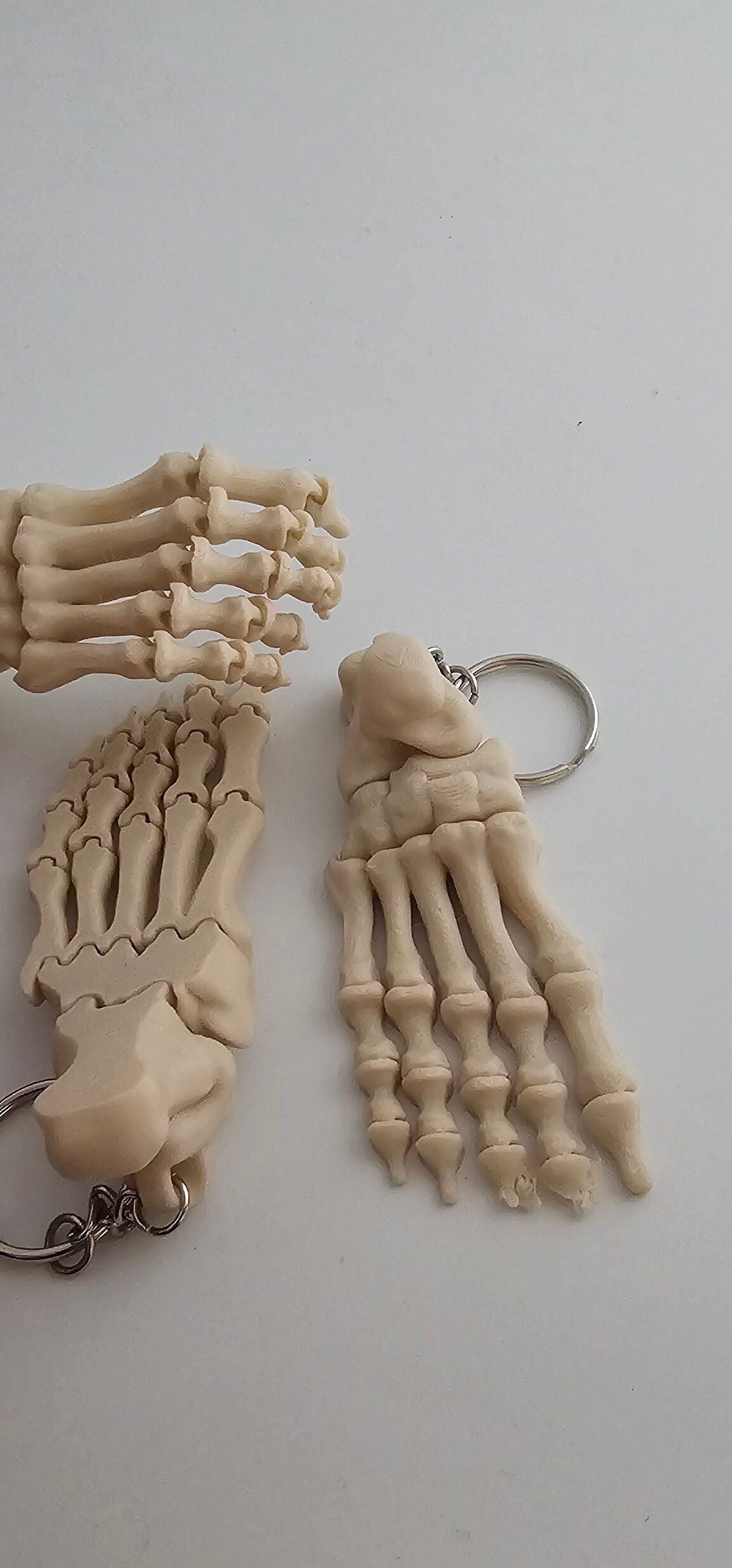 3D printed Small realistic articulated skeleton foot key ring 2 keyrings